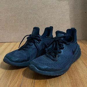 Black Nike woman tennis shoes.